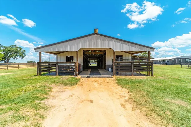 a kitchen with kitchen island granite countertop a sink and stove