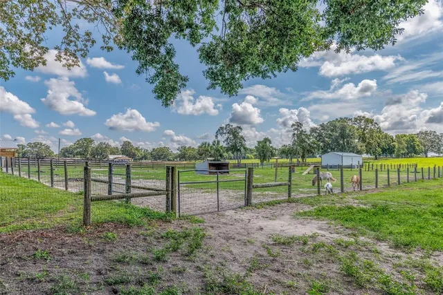 a view of a kitchen with a sink and a refrigerator