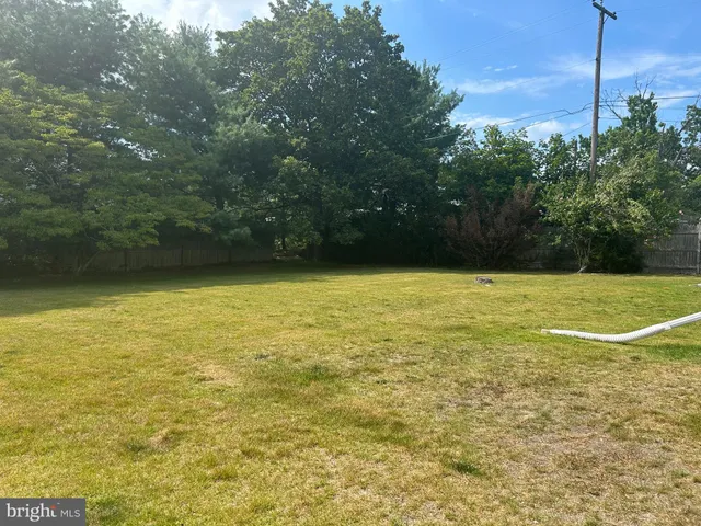 a view of a terrace with yard and mountain view