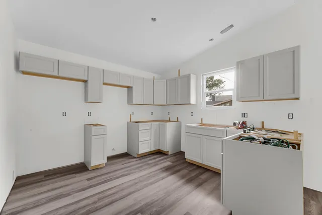 a kitchen with a sink and cabinets
