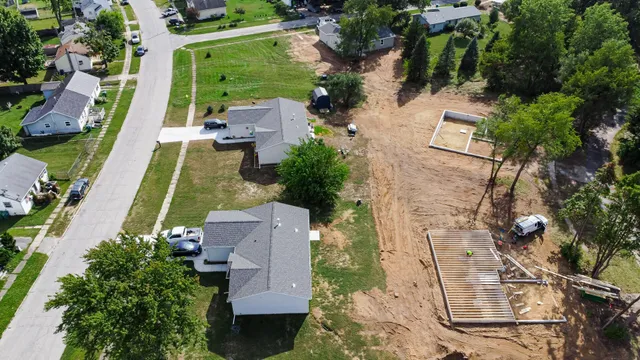 an aerial view of a house with outdoor space