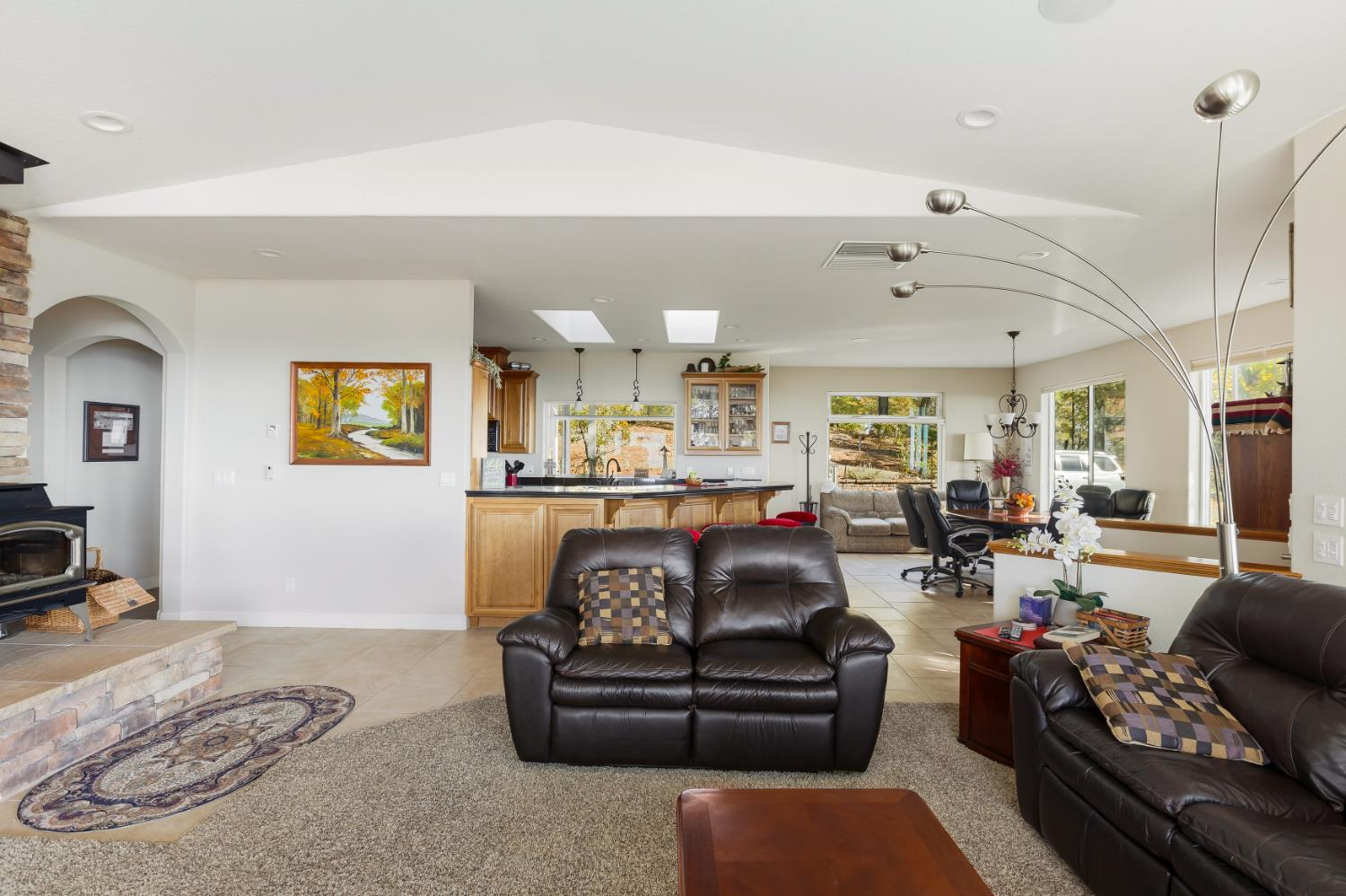 14990 Willow Glen Road Rackerby, CA 95972 - Photo 11 of 81 a living room with furniture kitchen and a chandelier