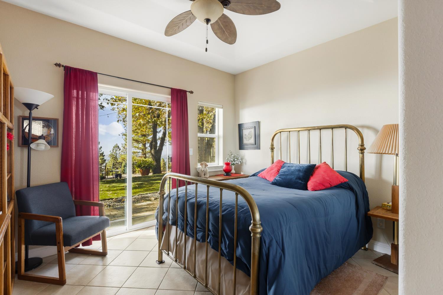 14990 Willow Glen Road Rackerby, CA 95972 - Photo 15 of 81 a bedroom with a bed and a chandelier