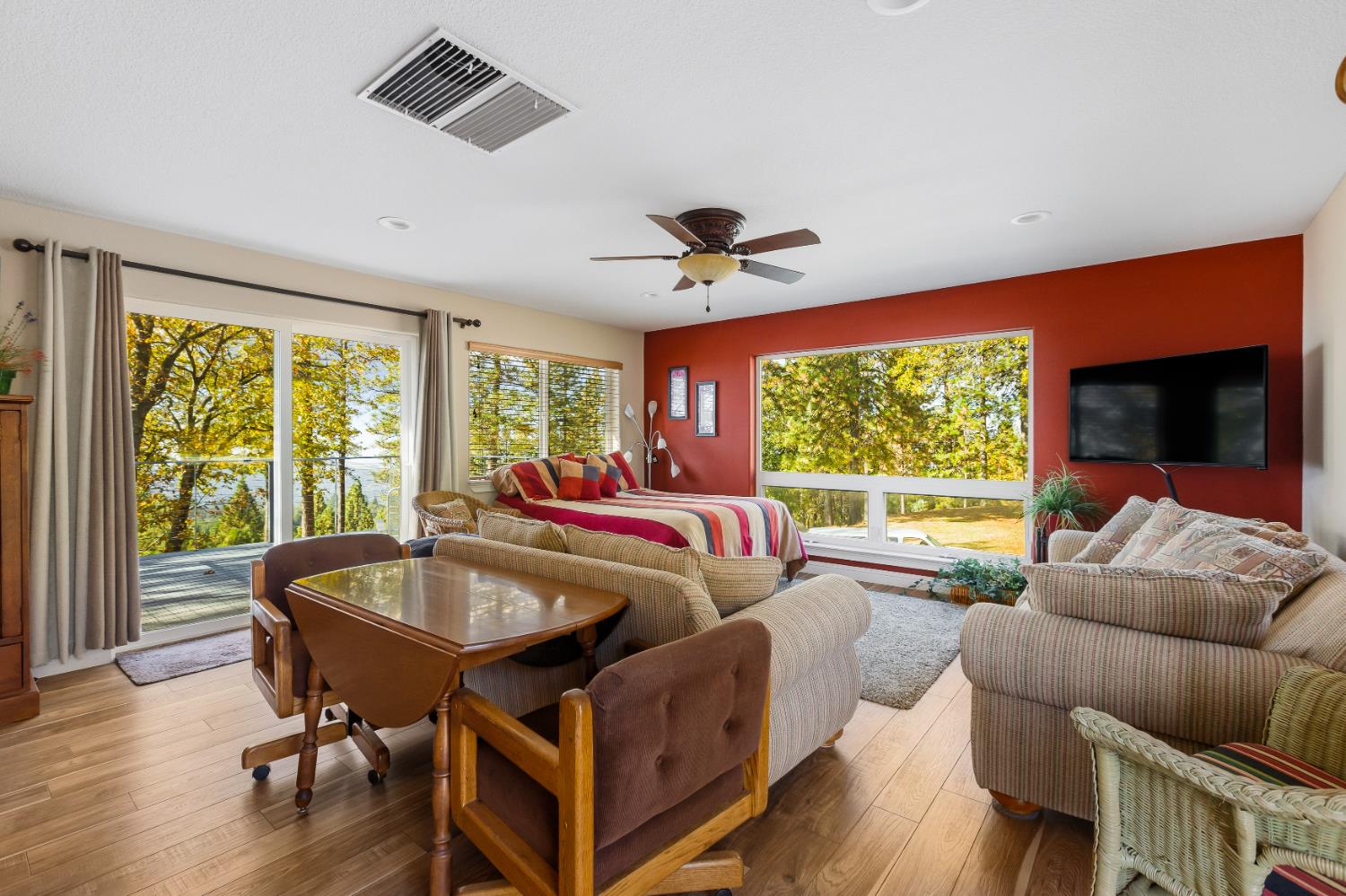 14990 Willow Glen Road Rackerby, CA 95972 - Photo 20 of 81 a living room with furniture a ceiling fan and a large window