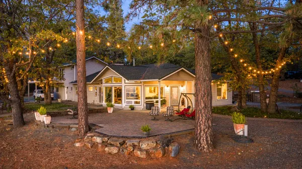 a view of a wooden wall with large trees