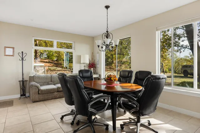 a view of a dining room with furniture window and outside view