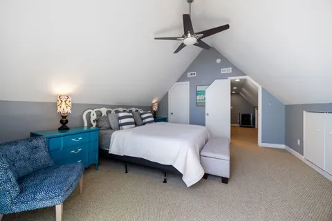 a bed room with a bed and a night stand
