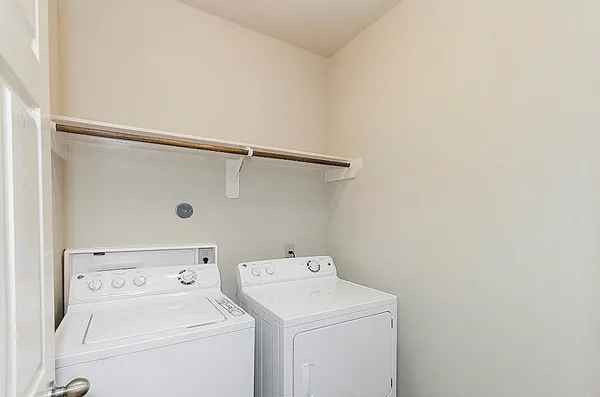 a view of storage room with washer and dryer