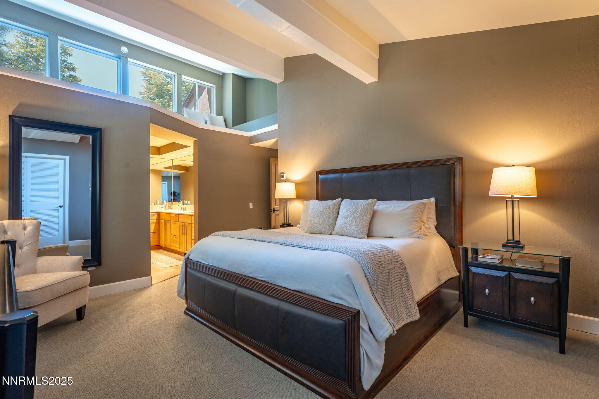 5 Kelly Circle Glenbrook, NV 89413 - Photo 16 of 38 a spacious bedroom with a bed and lamp