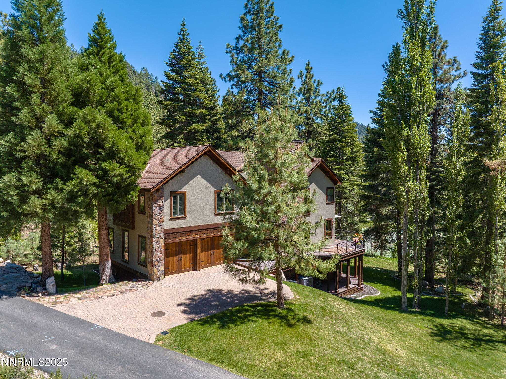 5 Kelly Circle Glenbrook, NV 89413 - Photo 2 of 38 a front view of a house with a garden and yard