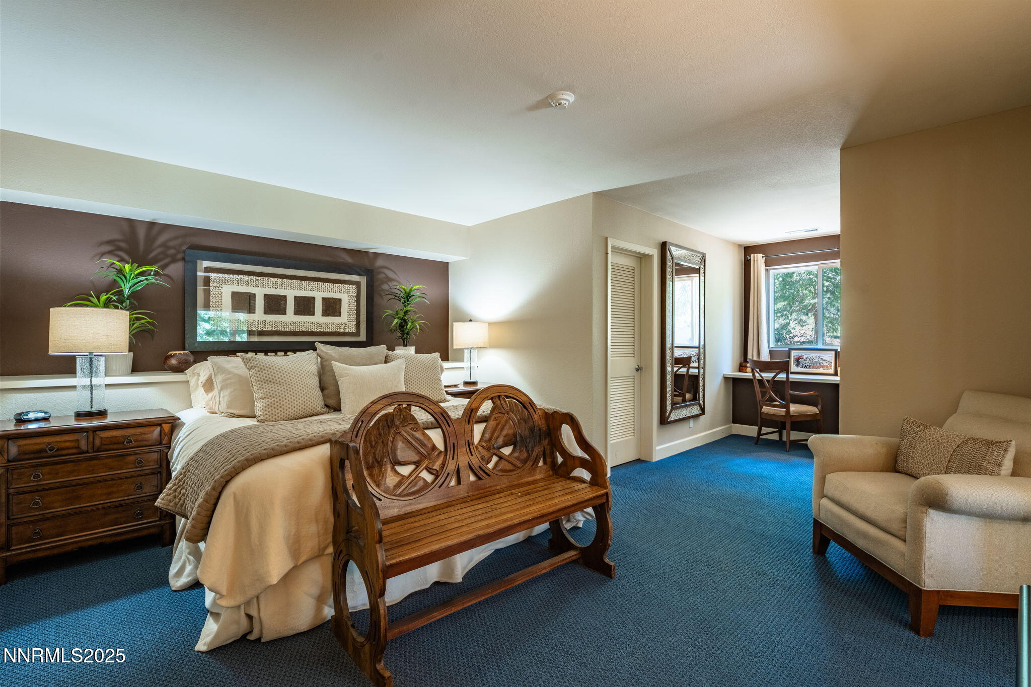 5 Kelly Circle Glenbrook, NV 89413 - Photo 21 of 38 a spacious bedroom with a bed and a couch