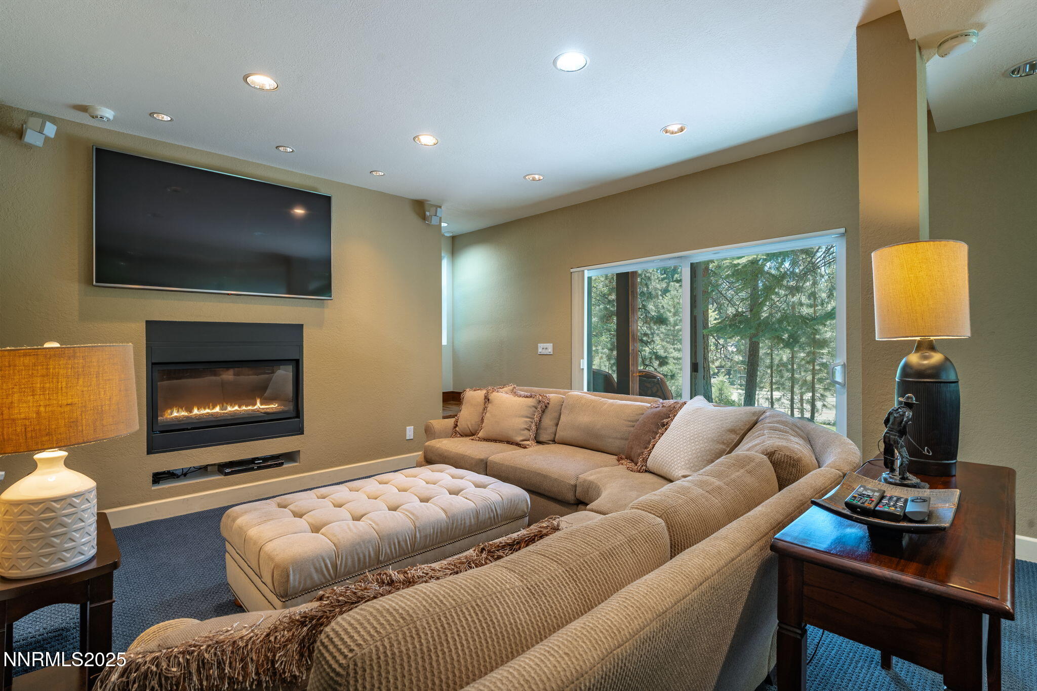 5 Kelly Circle Glenbrook, NV 89413 - Photo 25 of 38 a living room with furniture a flat screen tv and a fireplace