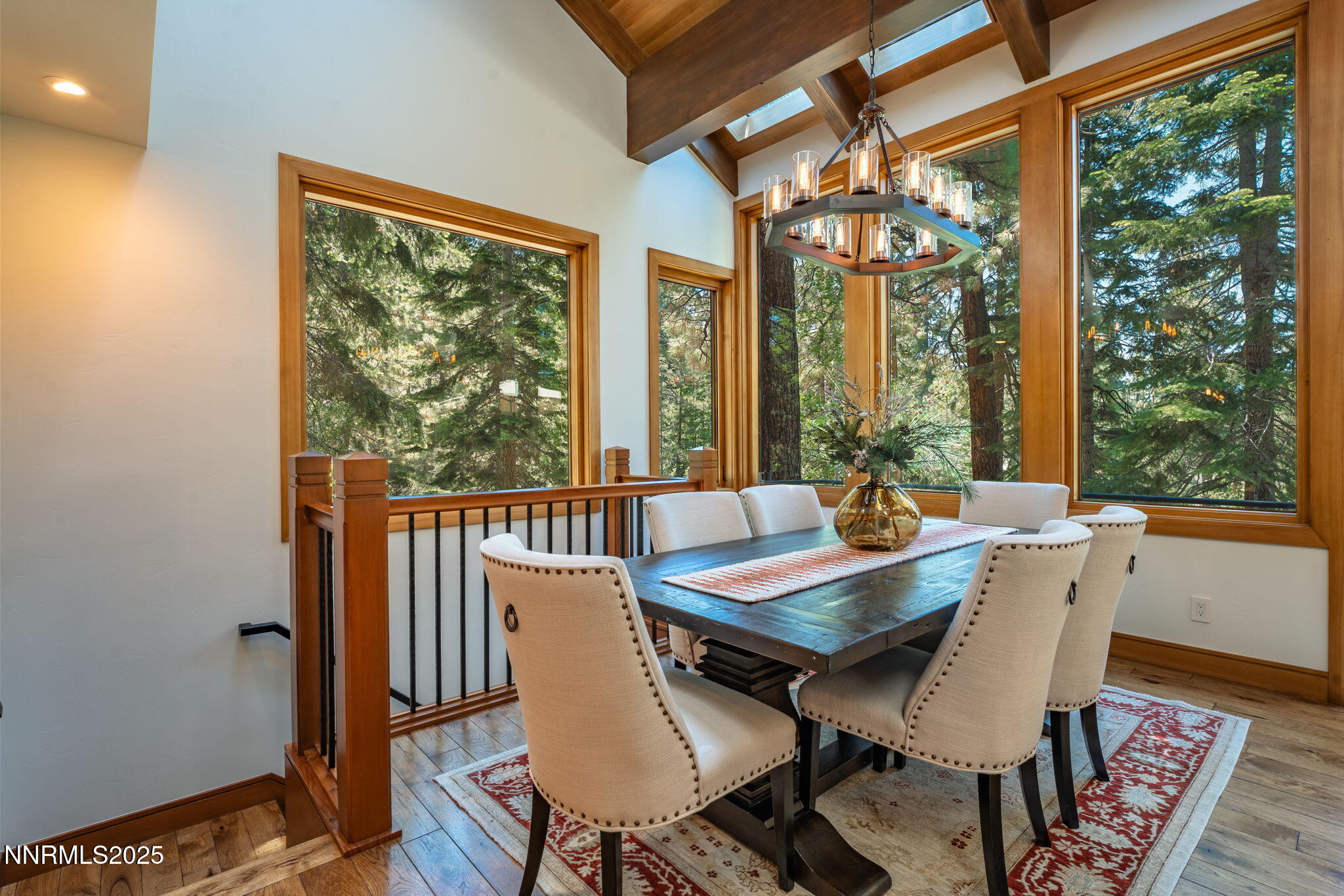 5 Kelly Circle Glenbrook, NV 89413 - Photo 8 of 38 a view of a dining room with furniture large windows and wooden floor