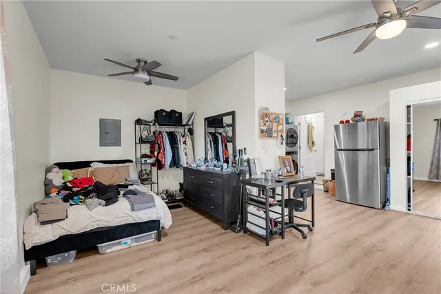 a living room with furniture and a kitchen view