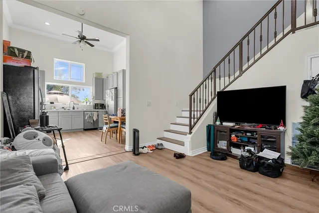 a view of a livingroom with furniture and a flat screen tv