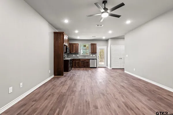 a view of a kitchen with a sink and a window