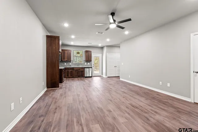a view of a kitchen with a sink and a window