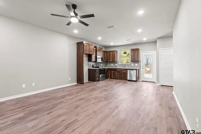 a view of a kitchen with a sink and a kitchen counter top space