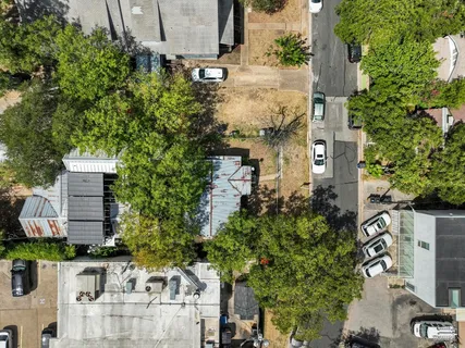 an aerial view of a house with outdoor space