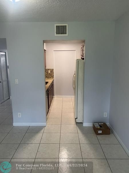 a hallway with a washer and dryer