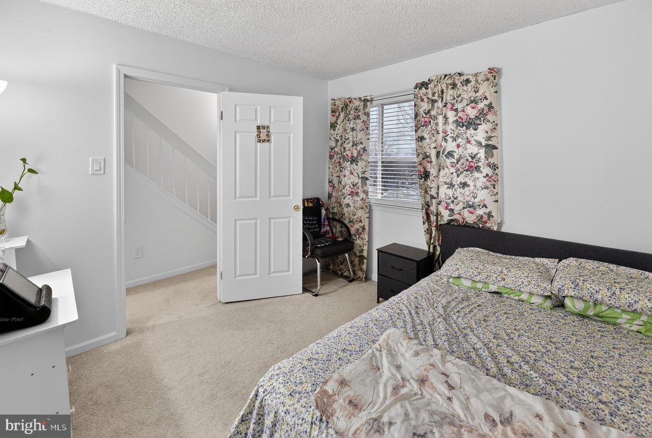423 Cannon Court, Unit 423 Chesterbrook, PA 19087 - Photo 16 of 26 a bedroom with a bed and a window
