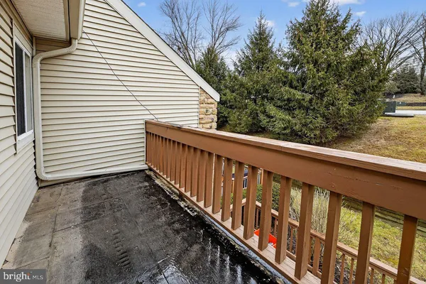 a view of a balcony with trees