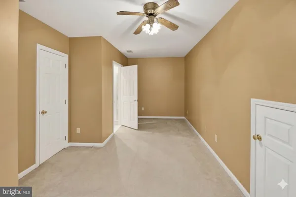 a view of a livingroom with a chandelier fan