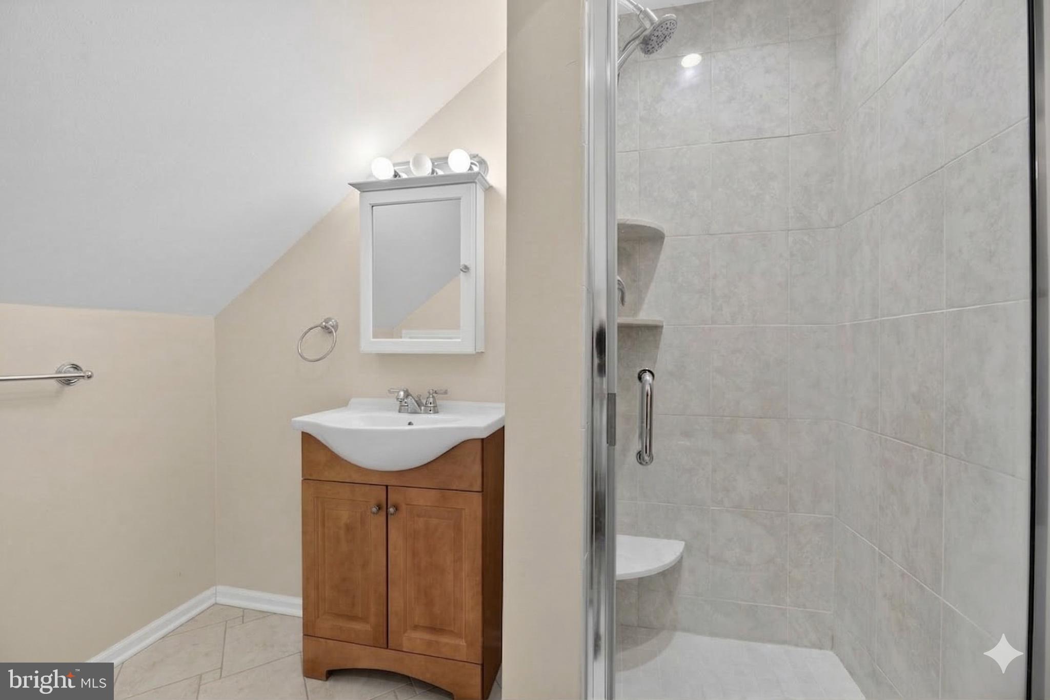 423 Cannon Court, Unit 423 Chesterbrook, PA 19087 - Photo 22 of 26 a bathroom with a sink a toilet and shower