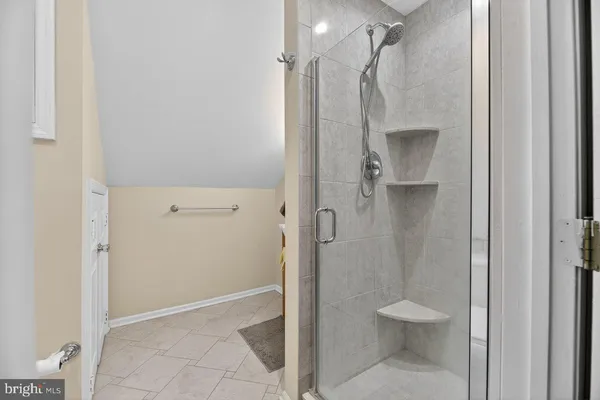 a bathroom with a shower and a toilet