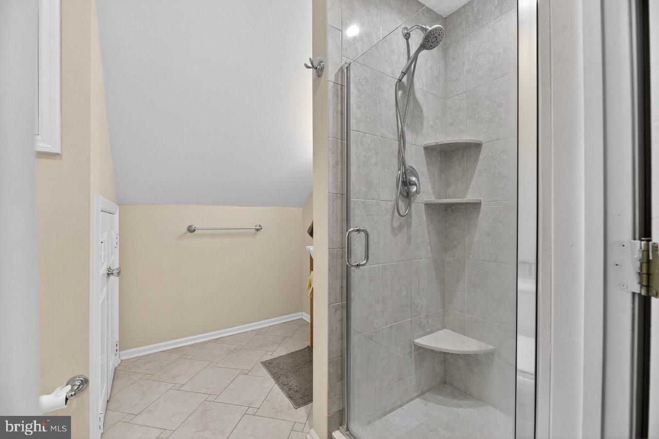 423 Cannon Court, Unit 423 Chesterbrook, PA 19087 - Photo 23 of 26 a bathroom with a shower and a toilet