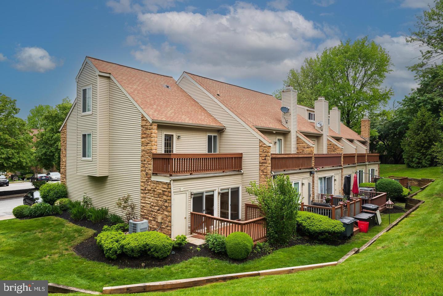 423 Cannon Court, Unit 423 Chesterbrook, PA 19087 - Photo 3 of 26 a front view of house with yard and green space