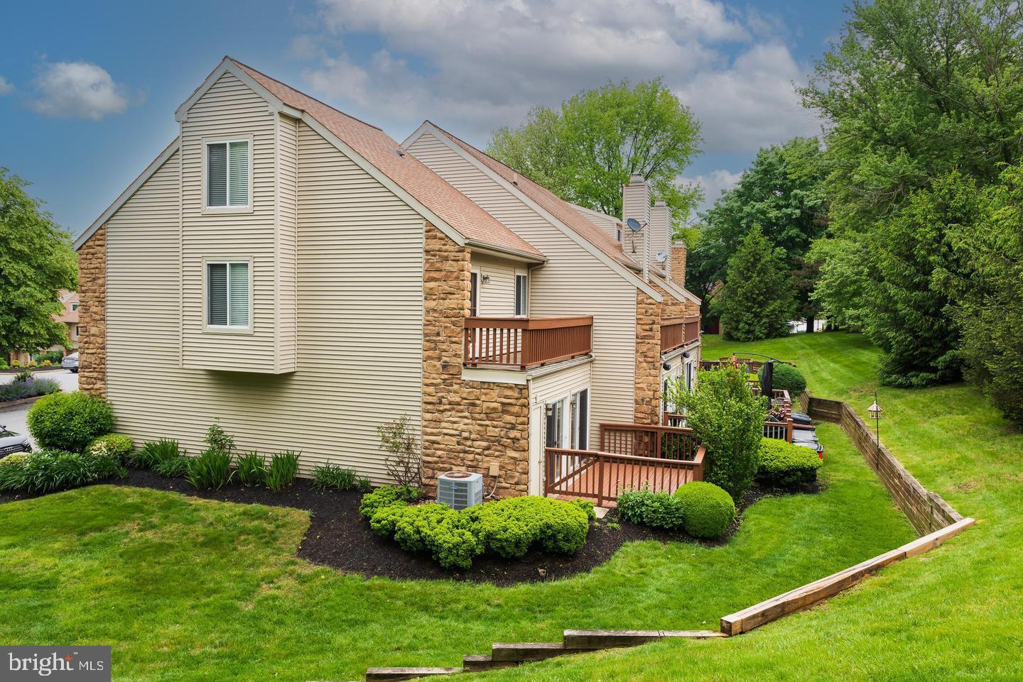 423 Cannon Court, Unit 423 Chesterbrook, PA 19087 - Photo 4 of 26 a front view of a house with a yard