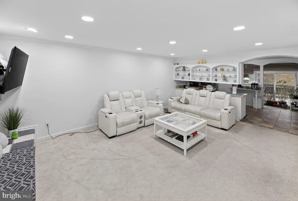 a living room with furniture and a couch