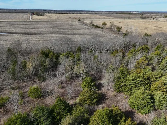 a view of a lake with beach and outdoor space