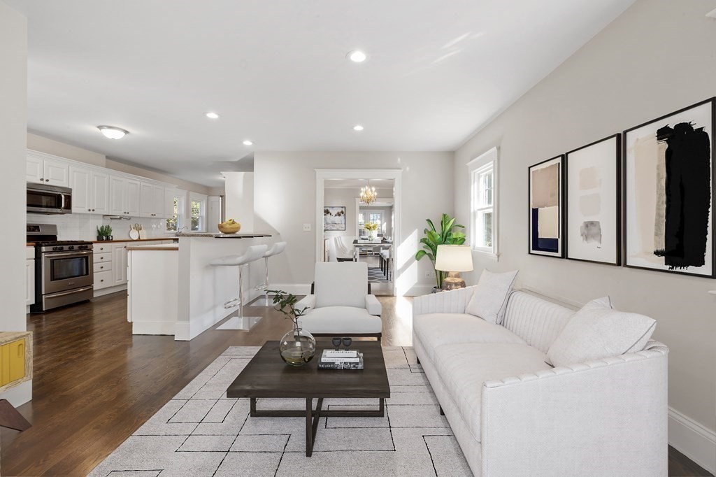 3 Dexter Road Wellesley, MA 02482 - Photo 13 of 40 a living room with stainless steel appliances kitchen island granite countertop furniture a rug kitchen view and a refrigerator