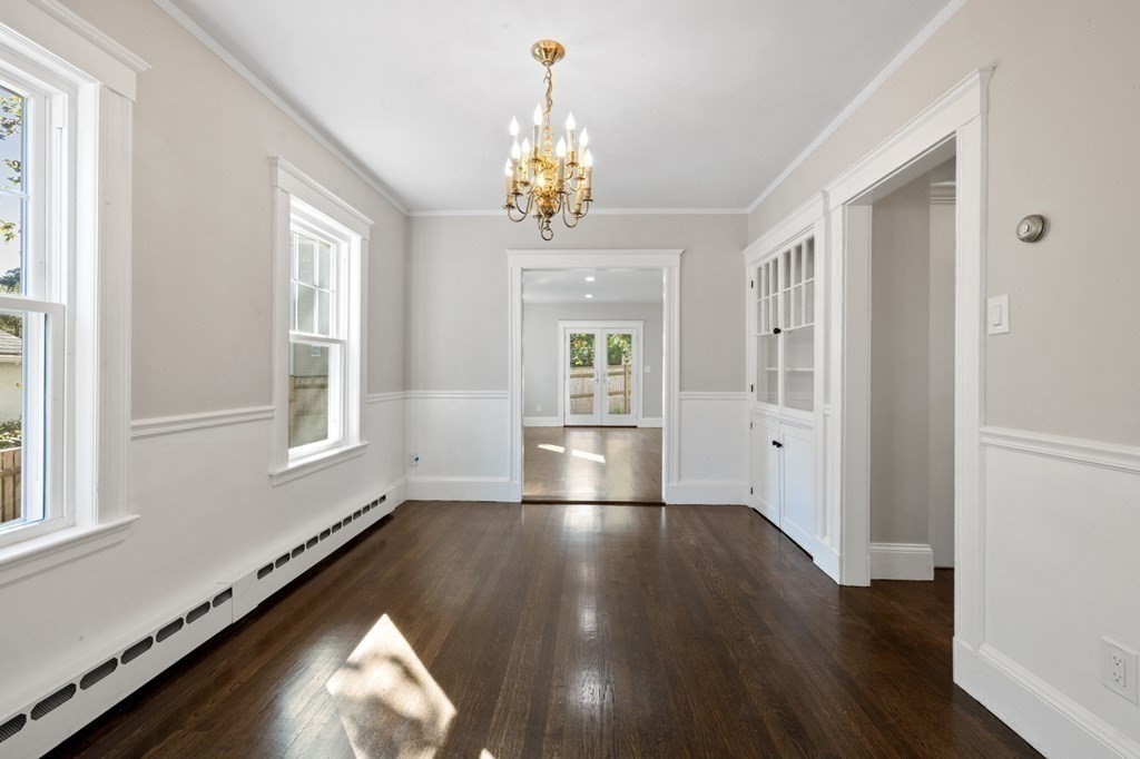 3 Dexter Road Wellesley, MA 02482 - Photo 17 of 40 wooden floor in an empty room with a window