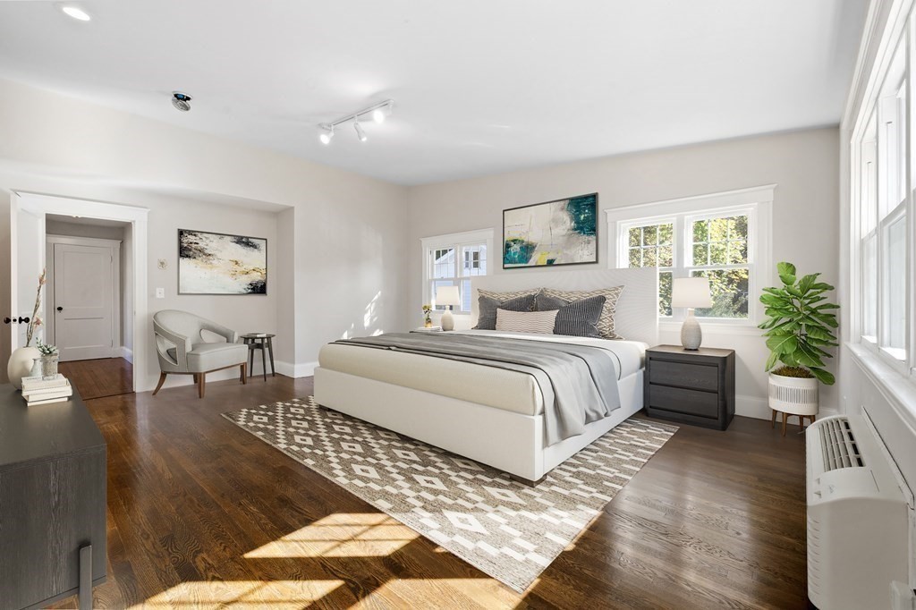 3 Dexter Road Wellesley, MA 02482 - Photo 20 of 40 a bedroom with a bed a couch and potted plant