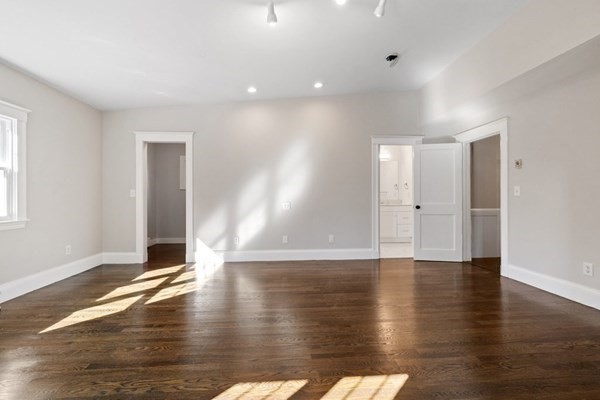 3 Dexter Road Wellesley, MA 02482 - Photo 23 of 40 a view of an empty room with wooden floor and a window