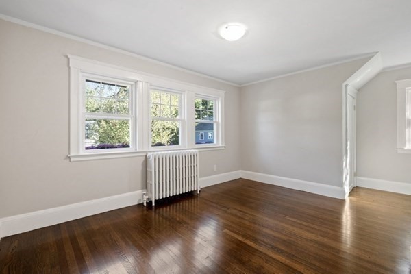 3 Dexter Road Wellesley, MA 02482 - Photo 28 of 40 an empty room with wooden floor and windows
