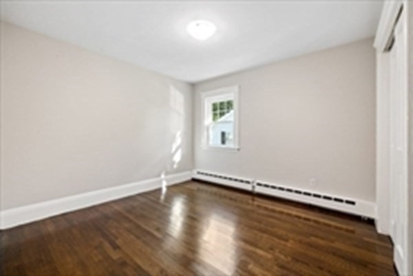 3 Dexter Road Wellesley, MA 02482 - Photo 30 of 40 an empty room with wooden floor and windows