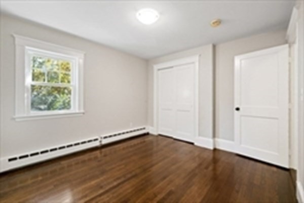 3 Dexter Road Wellesley, MA 02482 - Photo 31 of 40 an empty room with wooden floor and windows