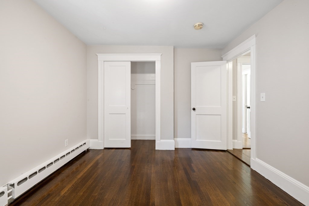 3 Dexter Road Wellesley, MA 02482 - Photo 32 of 40 an empty room with wooden floor