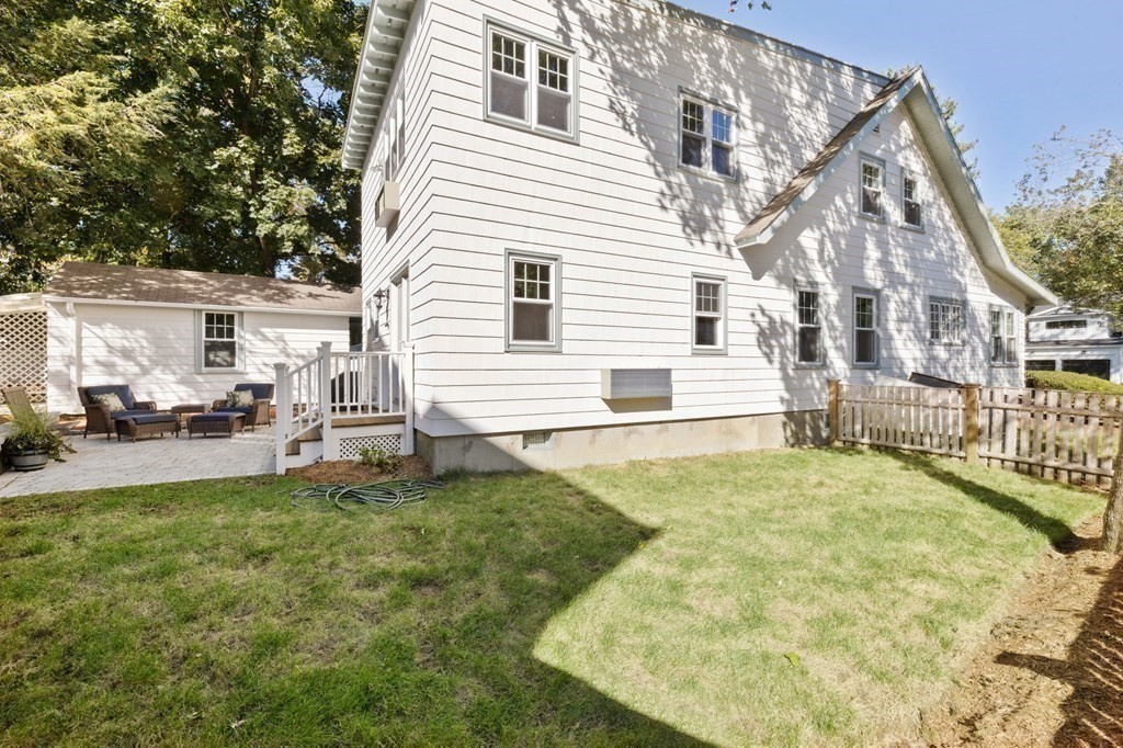 3 Dexter Road Wellesley, MA 02482 - Photo 37 of 40 a view of a white house with yard and sitting area