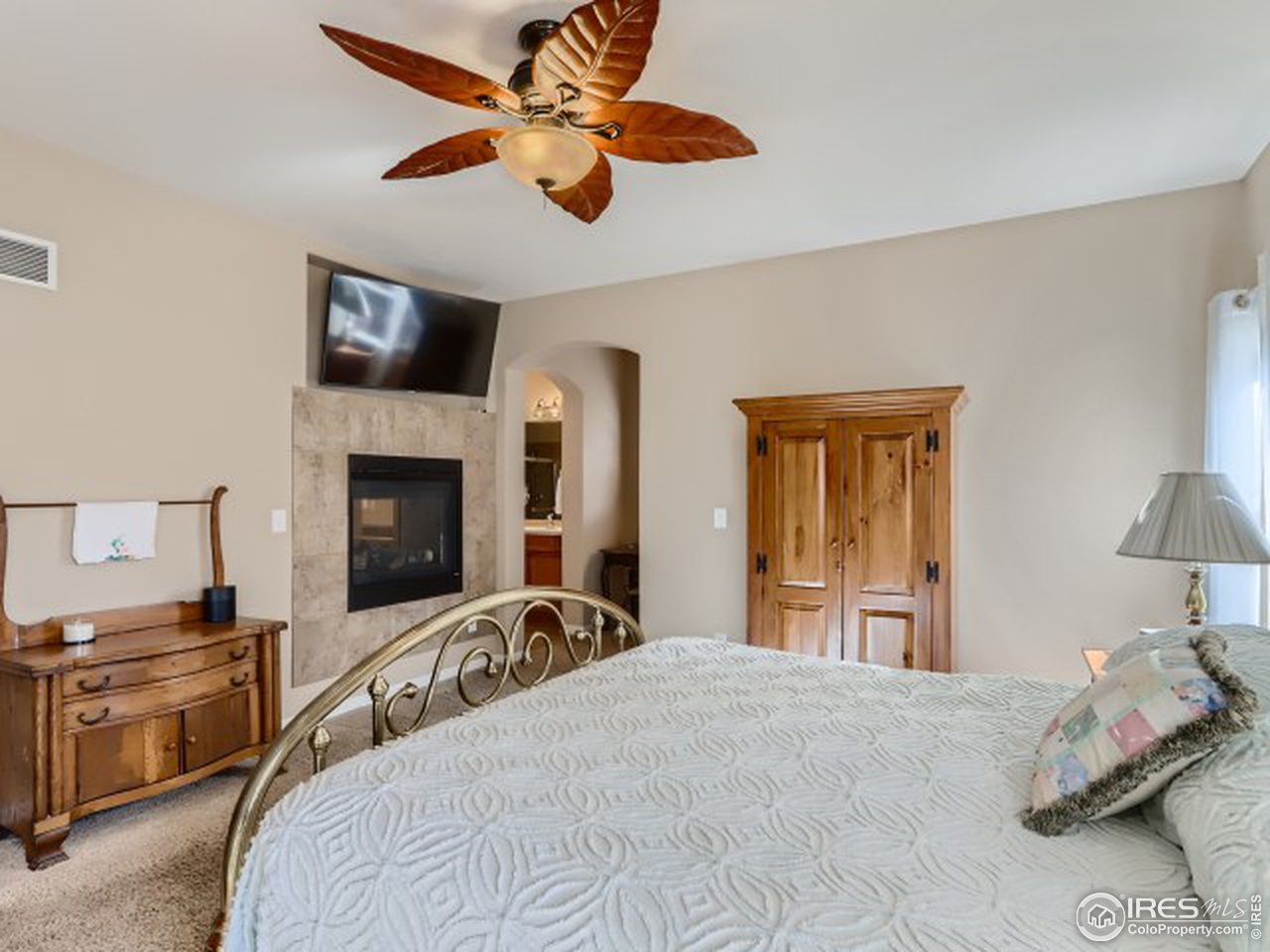 4205 Riley Drive Longmont, CO 80503 - Photo 13 of 30 Cozy fireplace in primary bedroom