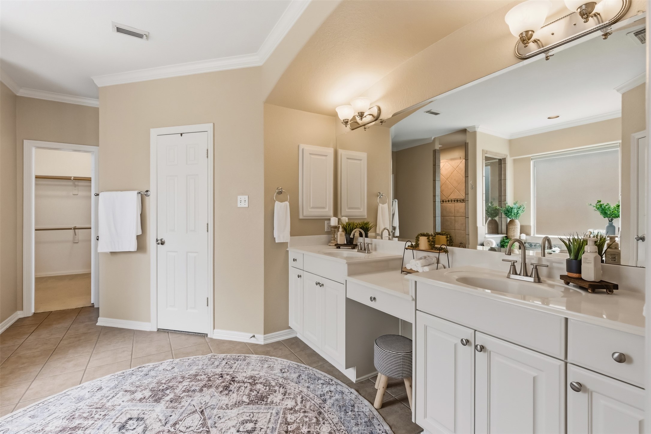 20722 Windrose Bend Drive Spring, TX 77379 - Photo 22 of 50 Indulge in the sophistication of this primary bath featuring double vanities, a spacious layout, and plenty of optional natural light for a serene and luxurious retreat.