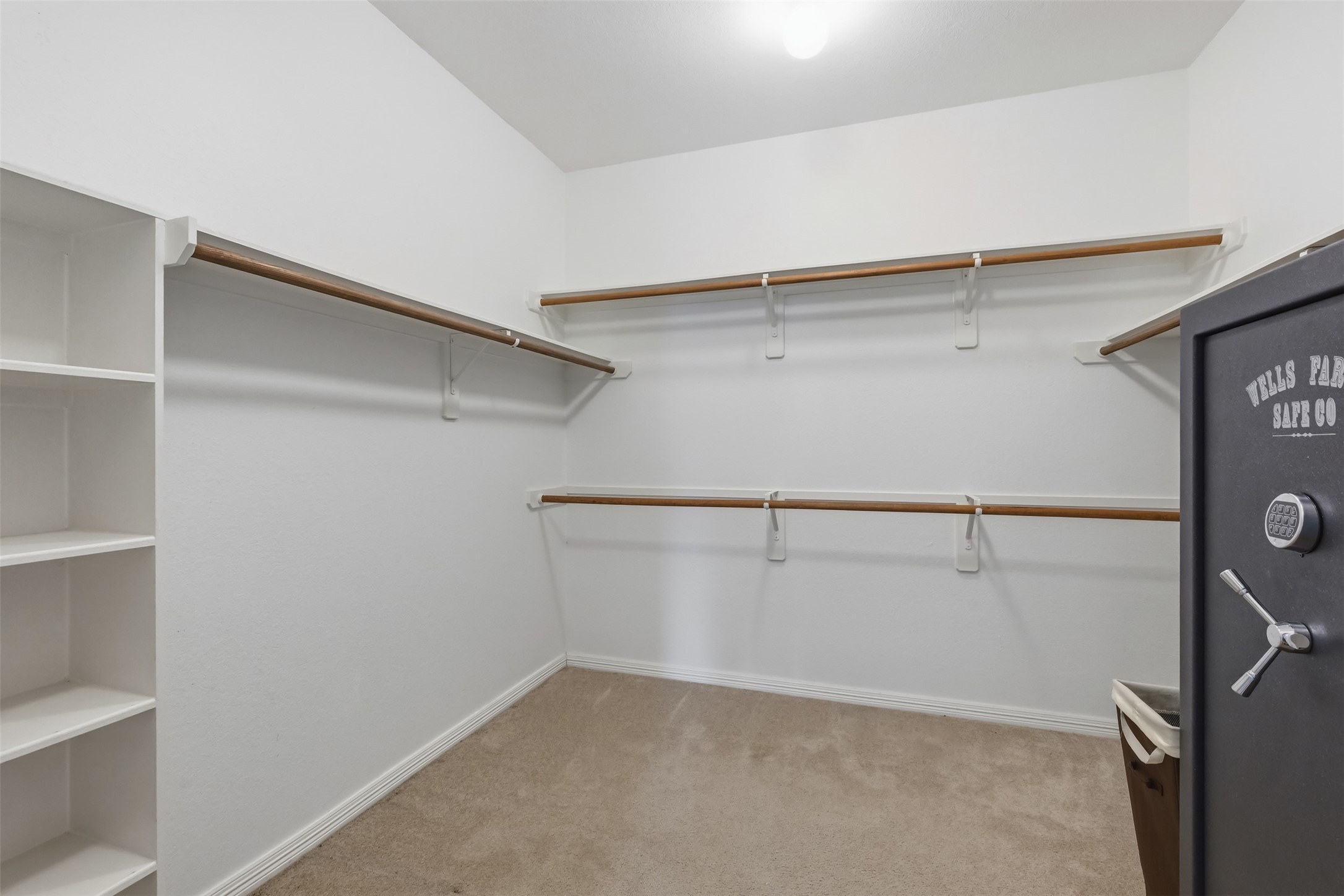 20722 Windrose Bend Drive Spring, TX 77379 - Photo 25 of 50 A glimpse at one of the two spacious closets in the primary suite, offering ample storage and sleek organization for all your wardrobe essentials.