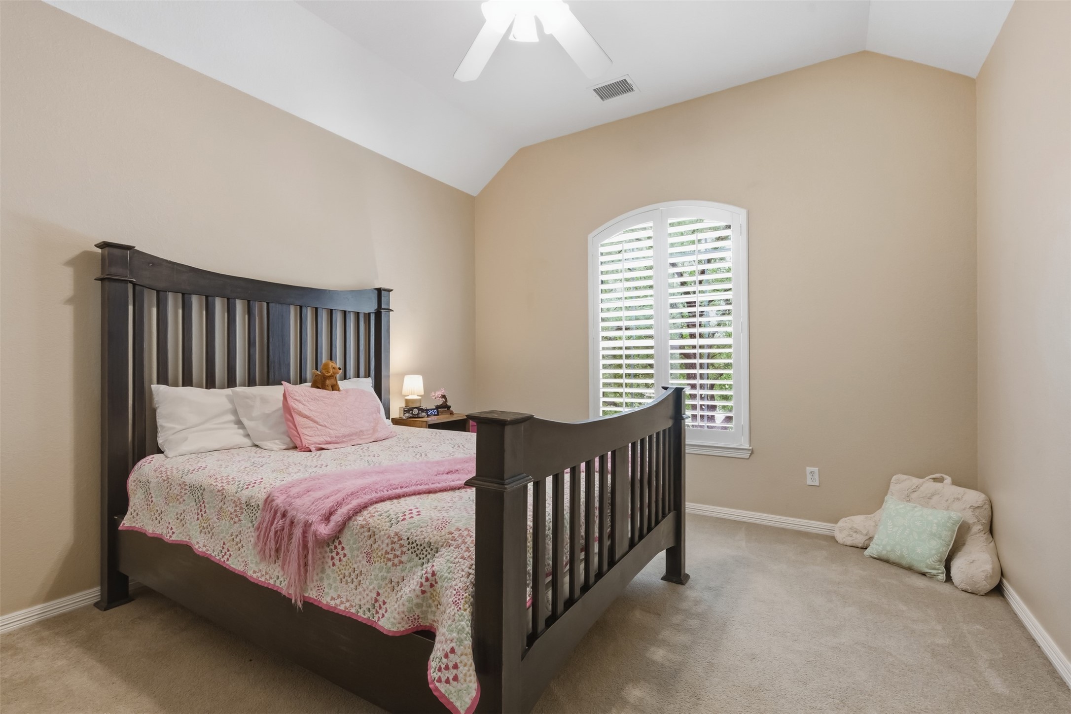 20722 Windrose Bend Drive Spring, TX 77379 - Photo 30 of 50 Cozy up in this charming third bedroom, located upstairs, offering a peaceful vibe with high ceilings, neutral tones, and sunlit window with elegant shutters.