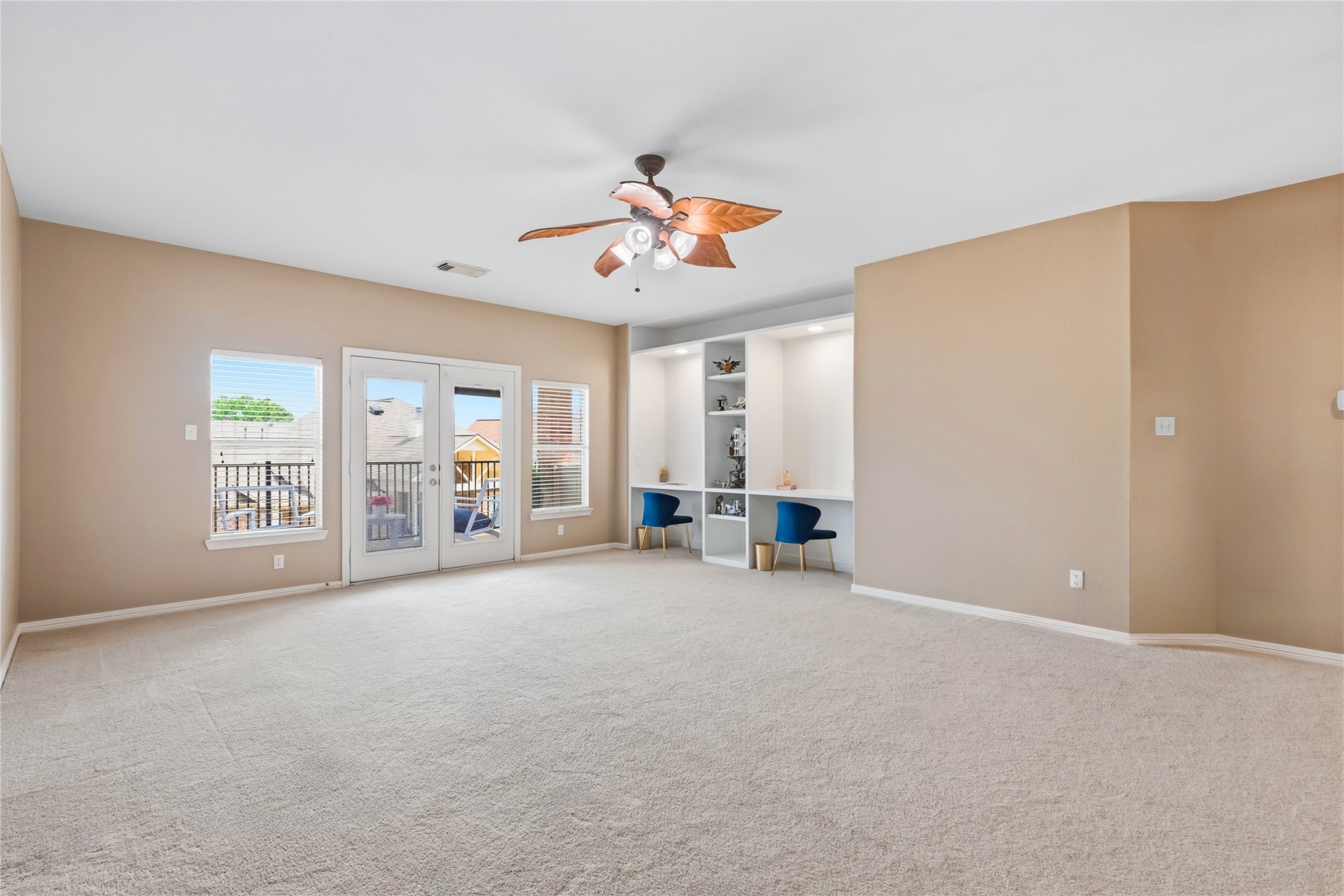 20722 Windrose Bend Drive Spring, TX 77379 - Photo 32 of 50 Your game room is upstairs with recently added custom built-in work stations, individual lighting and shelving, & the French door entrance to your outdoor balcony above the beautiful backyard.