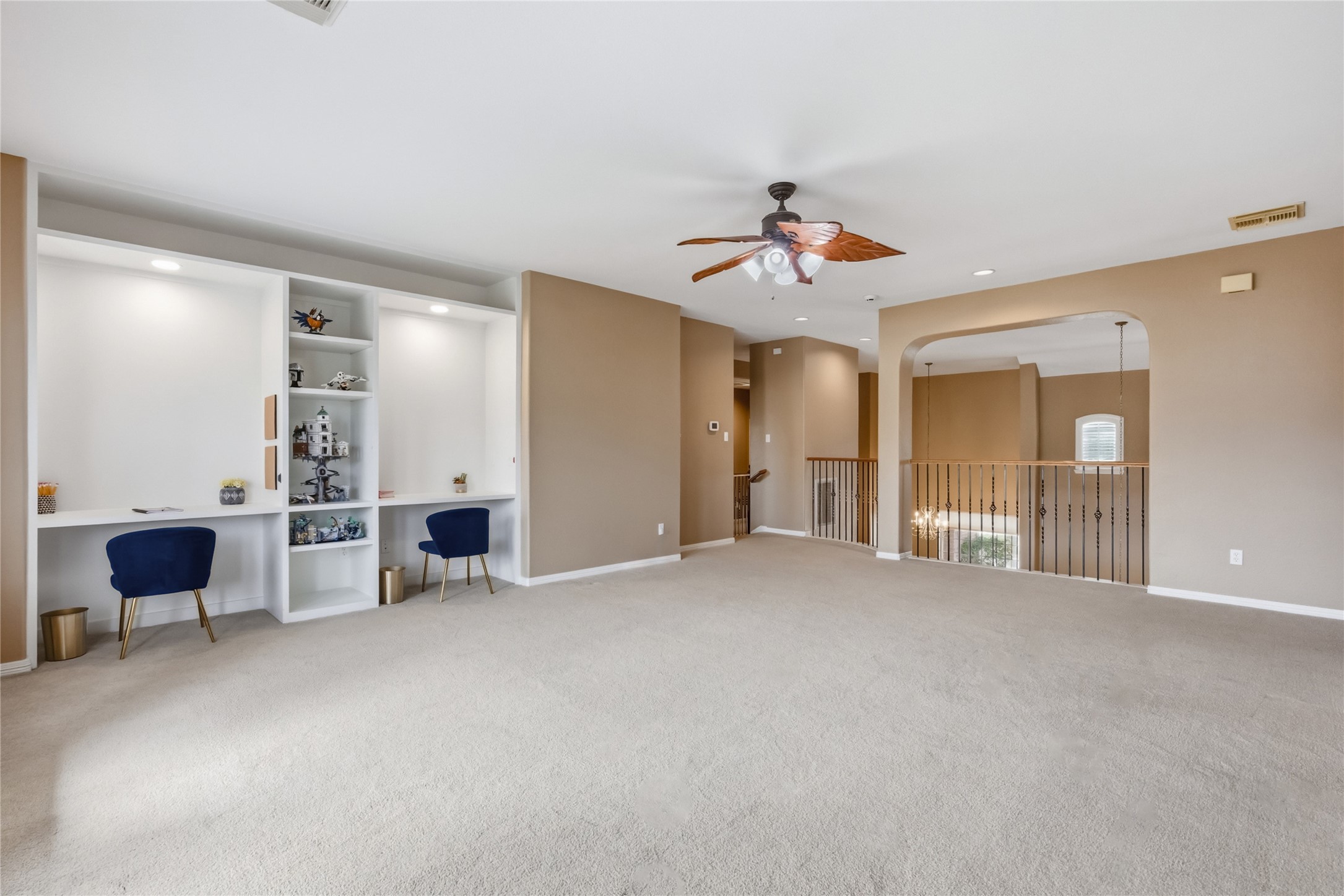 20722 Windrose Bend Drive Spring, TX 77379 - Photo 35 of 50 A stylish ceiling fan adds the perfect touch to your decor, while the open railing offers a view of the area below, enhancing the open feel of the home.
