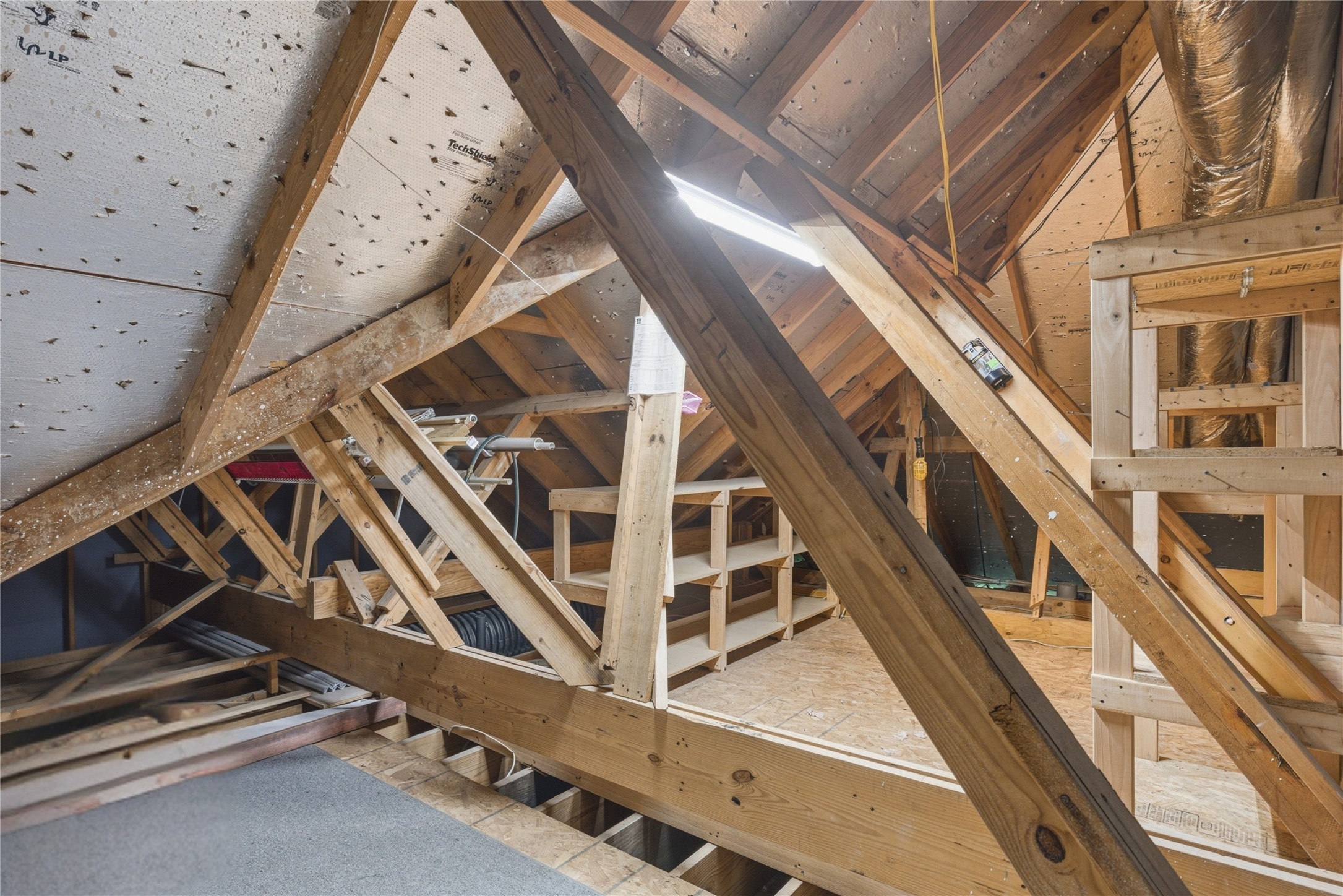 20722 Windrose Bend Drive Spring, TX 77379 - Photo 39 of 50 Storage! Storage! Storage! Here's a peek into the attic space, conveniently accessible through a full size door across from the guest bath upstairs.